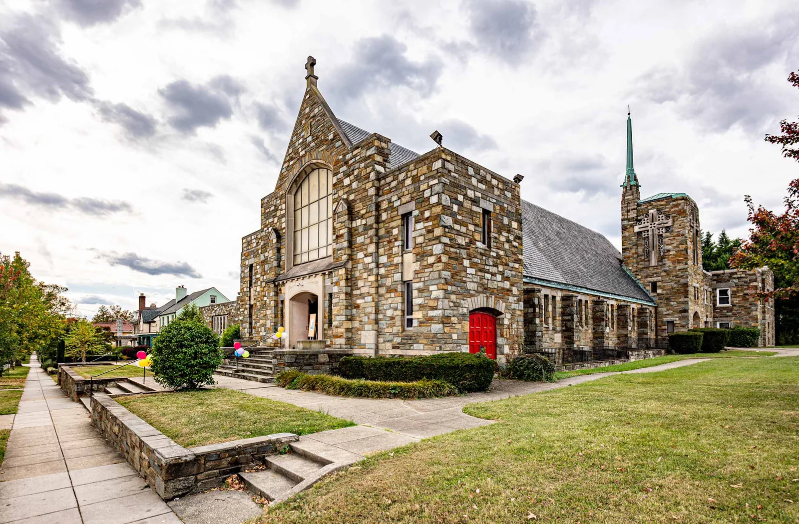 Northminster Presbyterian Church stone facade and red door on Alaska Ave NW
